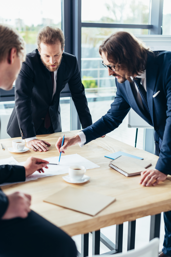 A New York Workers' Compensation lawyer works with their colleagues on a case
