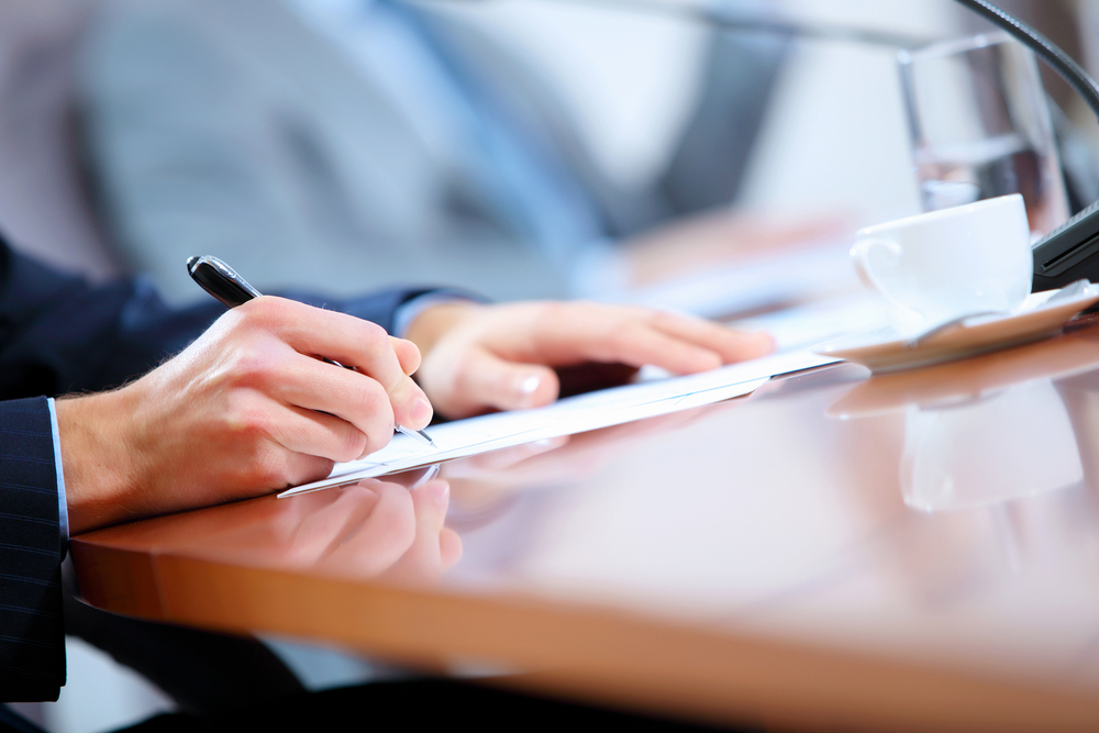 A New York Workers' Compensation lawyer filling out a claim for a client